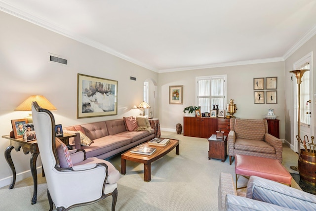 21 Orchard Dr, East Williston, NY 11596 - carpeted living room with crown molding and arched walkways