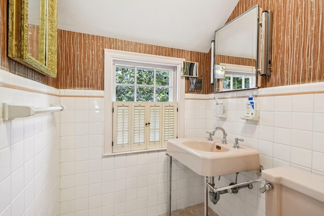 21 Orchard Dr, East Williston, NY 11596 - half bath with tile walls, lofted ceiling, and a wainscoted wall