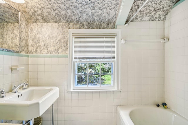 21 Orchard Dr, East Williston, NY 11596 - bathroom featuring tile walls and a garden tub