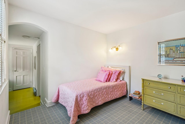 21 Orchard Dr, East Williston, NY 11596 - bedroom featuring dark carpet and arched walkways