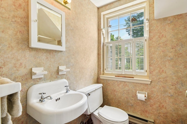 21 Orchard Dr, East Williston, NY 11596 - bathroom featuring a baseboard heating unit and wallpapered walls