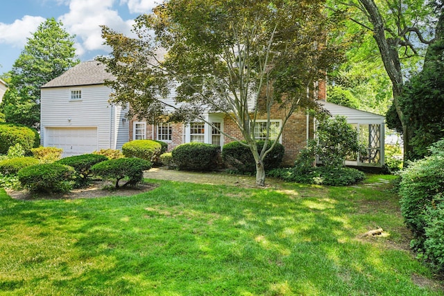 21 Orchard Dr, East Williston, NY 11596 - obstructed view of property with a garage, a front lawn, brick siding, and a chimney