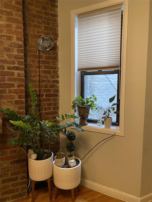 344 E 87th St Unit 3C, New York Manhattan, NY 10128 - detailed view of wood finished floors and brick wall
