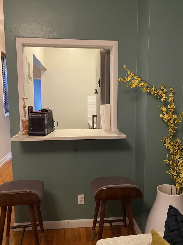 344 E 87th St Unit 3C, New York Manhattan, NY 10128 - bar area featuring wood finished floors and baseboards