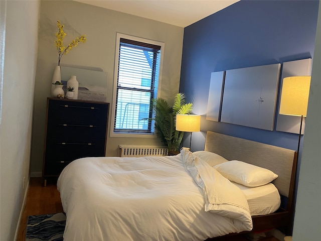 344 E 87th St Unit 3C, New York Manhattan, NY 10128 - bedroom with wood finished floors and radiator