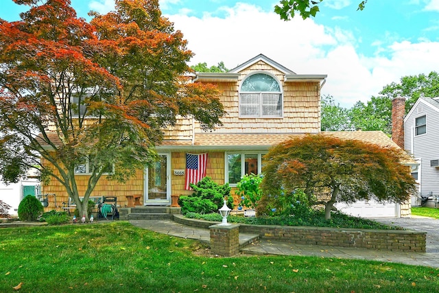 3665 Centerview Ave, Wantagh, NY 11793 - view of front of house featuring a front lawn, a garage, and entry steps
