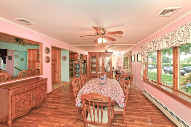 3665 Centerview Ave, Wantagh, NY 11793 - dining space featuring baseboard heating, ceiling fan, wood finished floors, and ornamental molding