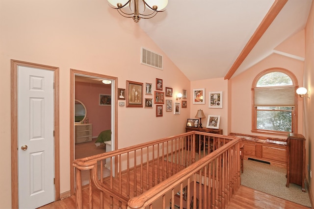 3665 Centerview Ave, Wantagh, NY 11793 - hall featuring light wood-style flooring, a chandelier, an upstairs landing, and high vaulted ceiling