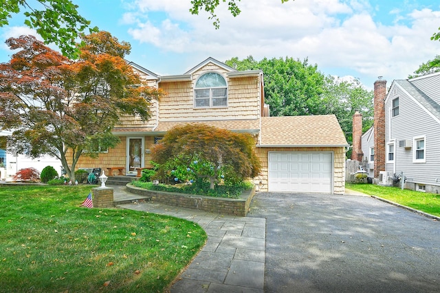 3665 Centerview Ave, Wantagh, NY 11793 - view of front of home with asphalt driveway, a front yard, a garage, and roof with shingles