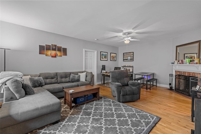 68 E Hartsdale Ave Unit 3K, Hartsdale, NY 10530 - living room with wood finished floors, ceiling fan, and a fireplace