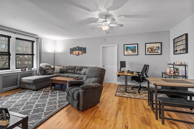 68 E Hartsdale Ave Unit 3K, Hartsdale, NY 10530 - living area with ceiling fan, light wood-style floors, and a desk
