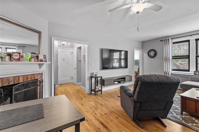 68 E Hartsdale Ave Unit 3K, Hartsdale, NY 10530 - living area with plenty of natural light, light wood-style floors, a ceiling fan, and a fireplace