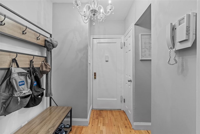 68 E Hartsdale Ave Unit 3K, Hartsdale, NY 10530 - mudroom with a chandelier and light wood-style flooring