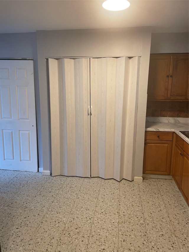 38 Sheffield Dr, Middletown, NY 10940 - kitchen with light countertops, brown cabinetry, and light floors