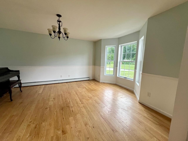 232 Minisink Tpke, Westtown, NY 10998 - unfurnished dining area featuring light wood finished floors, a chandelier, and a baseboard radiator