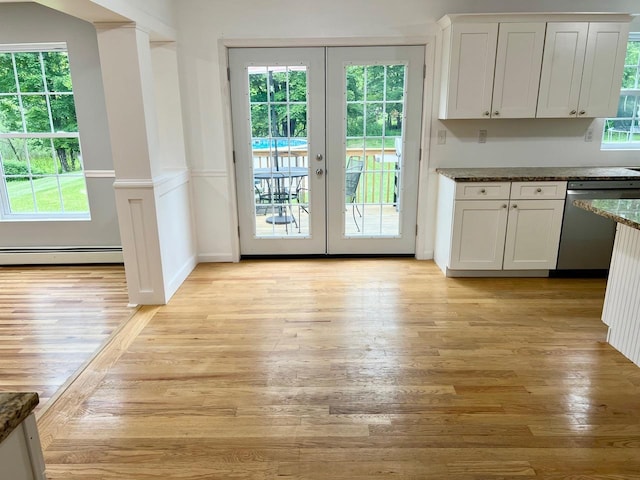 232 Minisink Tpke, Westtown, NY 10998 - kitchen featuring stainless steel dishwasher, a baseboard heating unit, french doors, and white cabinets