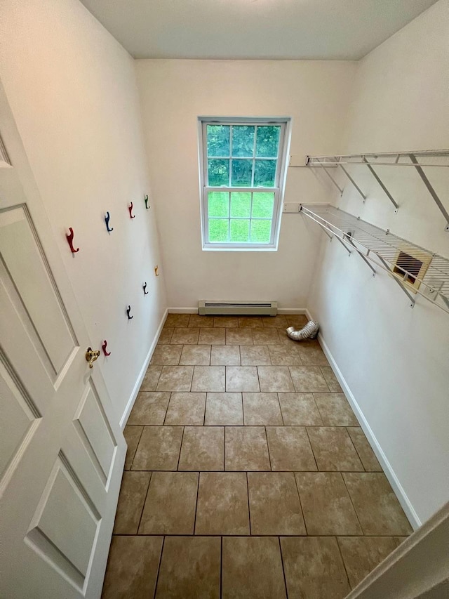 232 Minisink Tpke, Westtown, NY 10998 - laundry area with a baseboard radiator, gas dryer hookup, and tile patterned flooring
