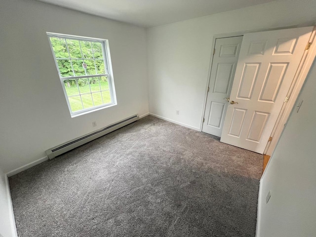 232 Minisink Tpke, Westtown, NY 10998 - unfurnished bedroom with a baseboard radiator and carpet floors