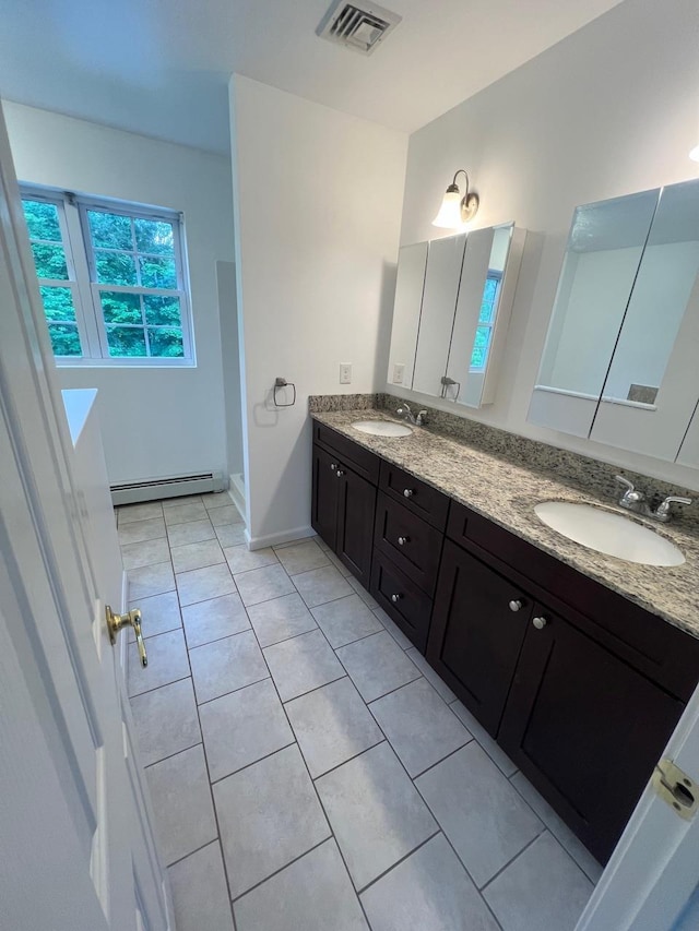232 Minisink Tpke, Westtown, NY 10998 - bathroom with double vanity, a baseboard radiator, and tile patterned floors