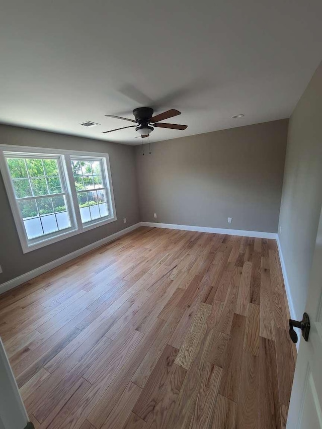 56 Bayberry Ln, Levittown, NY 11756 - unfurnished room featuring ceiling fan and light wood finished floors