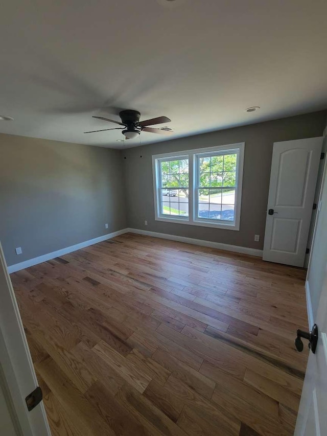 56 Bayberry Ln, Levittown, NY 11756 - spare room featuring ceiling fan and wood finished floors