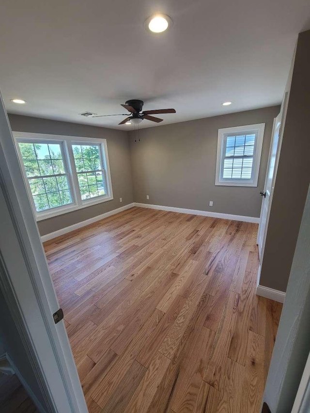 56 Bayberry Ln, Levittown, NY 11756 - spare room with light wood finished floors, a ceiling fan, and recessed lighting