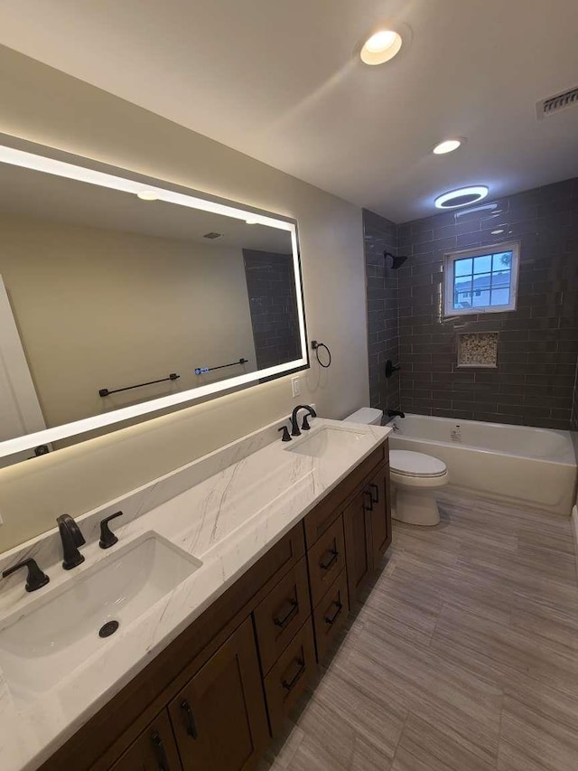 56 Bayberry Ln, Levittown, NY 11756 - bathroom featuring double vanity, shower / washtub combination, and recessed lighting
