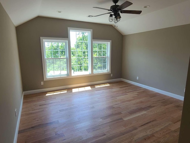 56 Bayberry Ln, Levittown, NY 11756 - additional living space with vaulted ceiling, a ceiling fan, and wood finished floors