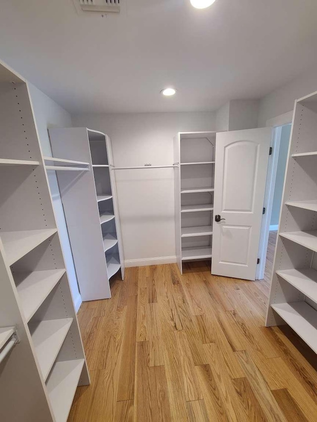 56 Bayberry Ln, Levittown, NY 11756 - spacious closet featuring wood finished floors