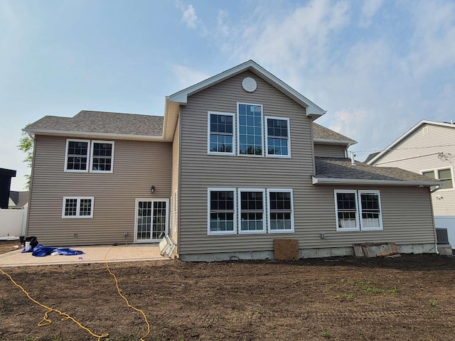 56 Bayberry Ln, Levittown, NY 11756 - back of house featuring a patio area and a shingled roof
