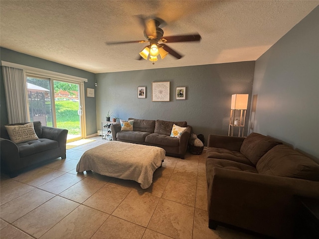 7 Walnut Ct, Goshen, NY 10924 - living room featuring a textured ceiling, light tile patterned flooring, and ceiling fan