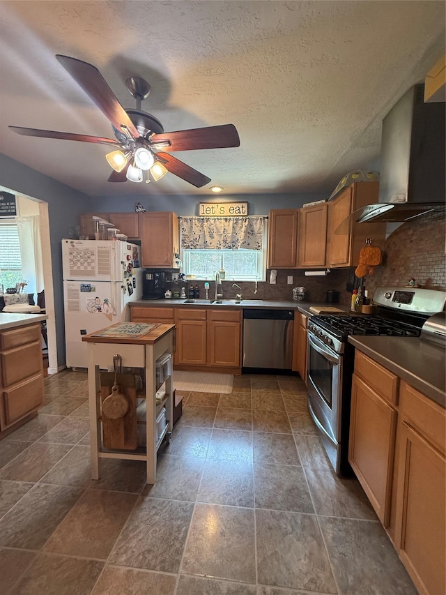 7 Walnut Ct, Goshen, NY 10924 - kitchen with appliances with stainless steel finishes, wall chimney range hood, healthy amount of natural light, and decorative backsplash