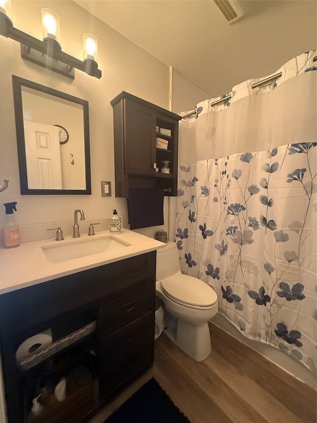 7 Walnut Ct, Goshen, NY 10924 - bathroom featuring wood finished floors, vanity, and curtained shower