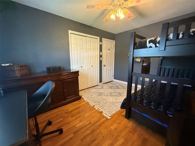 7 Walnut Ct, Goshen, NY 10924 - bedroom with light wood finished floors, a desk, a closet, and ceiling fan
