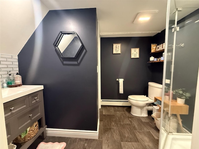 7 Walnut Ct, Goshen, NY 10924 - bathroom with baseboard heating, vanity, a stall shower, and backsplash