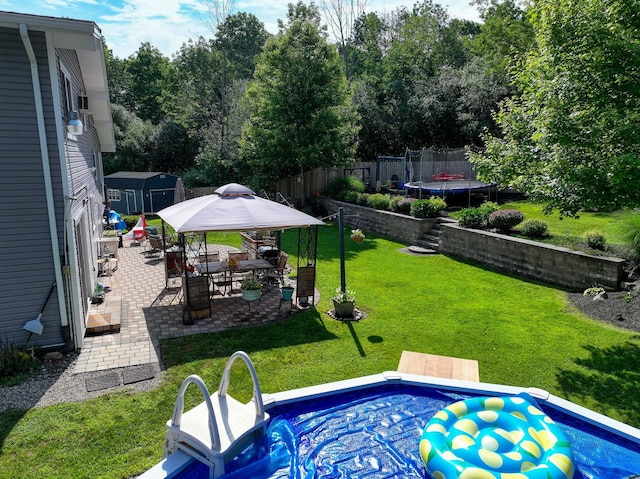 7 Walnut Ct, Goshen, NY 10924 - view of pool with a trampoline, a gazebo, a patio, and view of wooded area