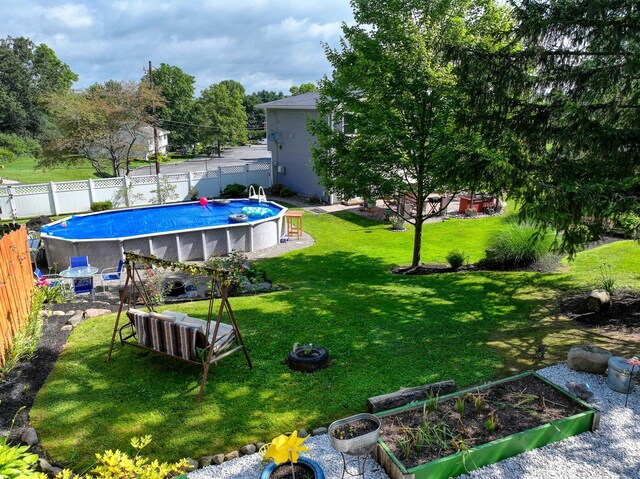 7 Walnut Ct, Goshen, NY 10924 - fenced backyard featuring a vegetable garden
