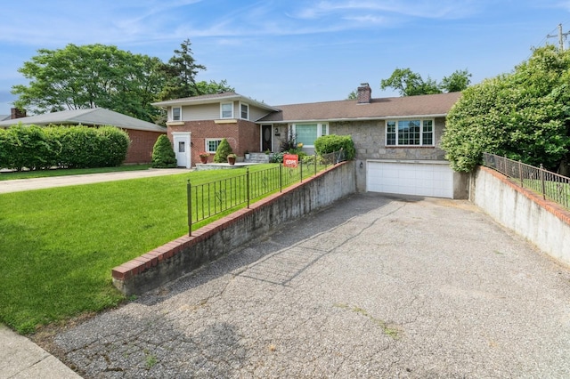 114 Birchwood Park Dr, Syosset, NY 11791 - tri-level home featuring a chimney, driveway, a garage, and brick siding