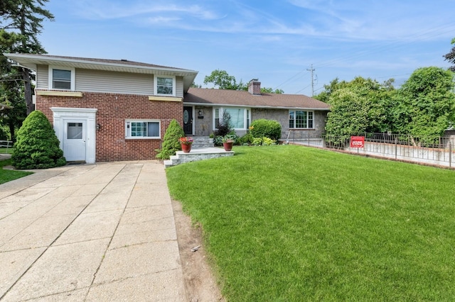 114 Birchwood Park Dr, Syosset, NY 11791 - tri-level home with brick siding and a chimney