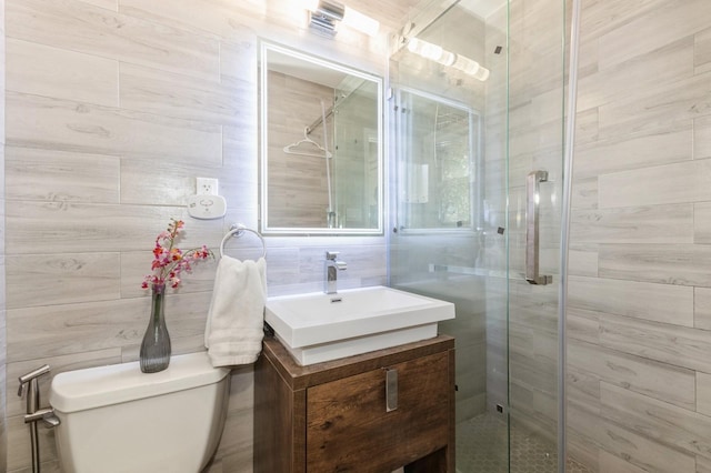 114 Birchwood Park Dr, Syosset, NY 11791 - bathroom with vanity, a stall shower, and tile walls