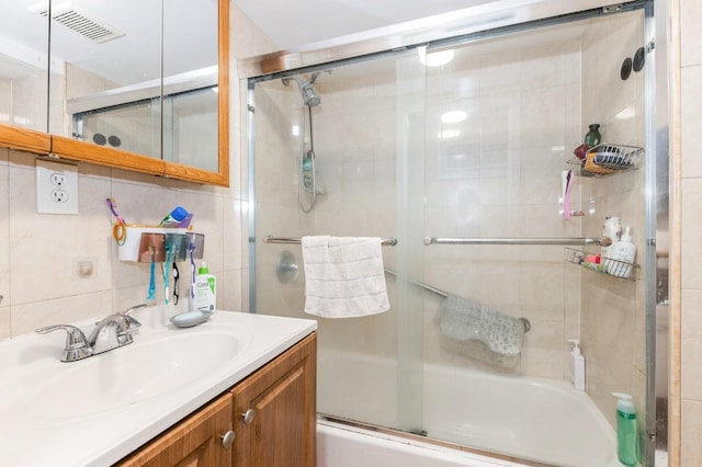114 Birchwood Park Dr, Syosset, NY 11791 - bathroom featuring bath / shower combo with glass door and vanity