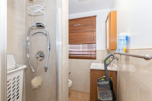 114 Birchwood Park Dr, Syosset, NY 11791 - full bath with tile walls, vanity, a stall shower, and tile patterned flooring