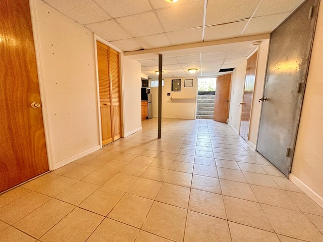 114 Birchwood Park Dr, Syosset, NY 11791 - spare room with light tile patterned floors and a paneled ceiling