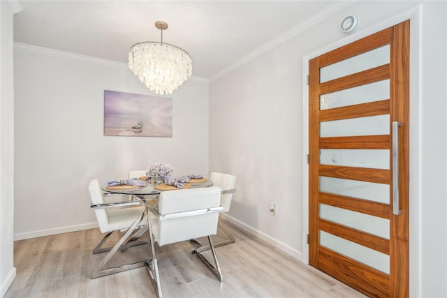 55 Duckpond Dr N, Wantagh, NY 11793 - dining area featuring wood finished floors, crown molding, and a chandelier