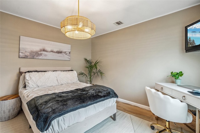 55 Duckpond Dr N, Wantagh, NY 11793 - bedroom featuring a chandelier, wood finished floors, ornamental molding, and a desk