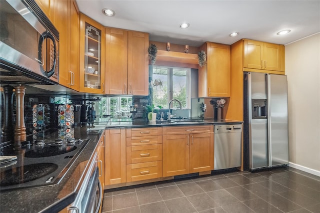 55 Duckpond Dr N, Wantagh, NY 11793 - kitchen featuring stainless steel appliances, backsplash, recessed lighting, glass insert cabinets, and dark stone countertops