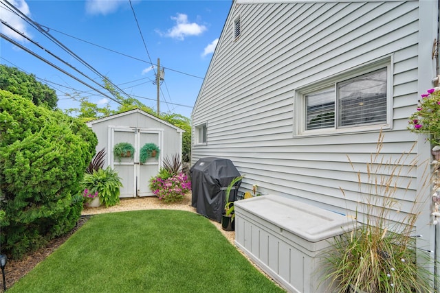 55 Duckpond Dr N, Wantagh, NY 11793 - view of green lawn featuring a storage shed