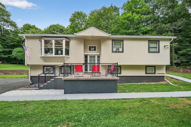411 Fair Oaks Rd, Middletown, NY 10940 - view of front of house with stucco siding and a front lawn