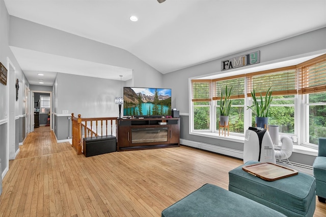 411 Fair Oaks Rd, Middletown, NY 10940 - living room with a baseboard radiator, vaulted ceiling, wood finished floors, healthy amount of natural light, and baseboard heating