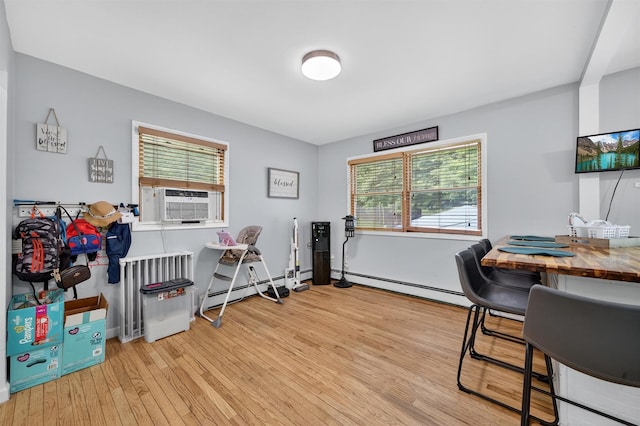 411 Fair Oaks Rd, Middletown, NY 10940 - home office featuring wood finished floors, healthy amount of natural light, and a baseboard heating unit